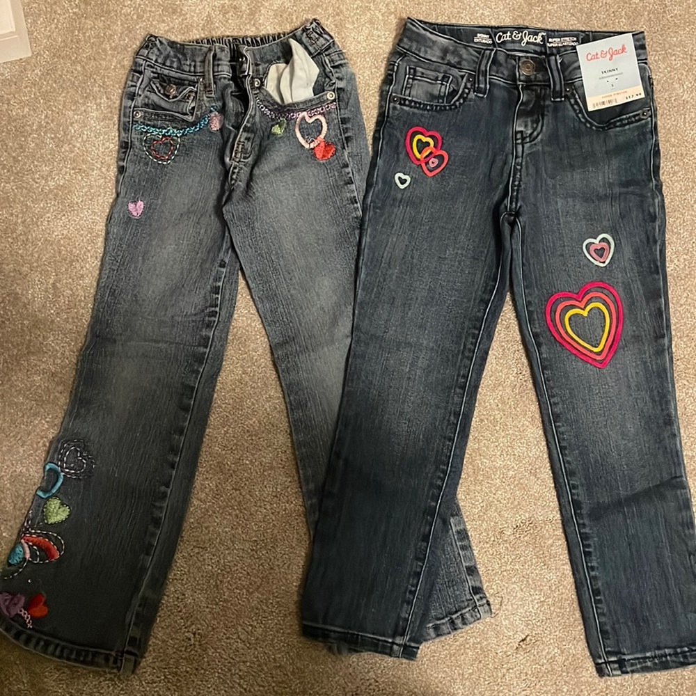 Two pair of patterned jeans for girls